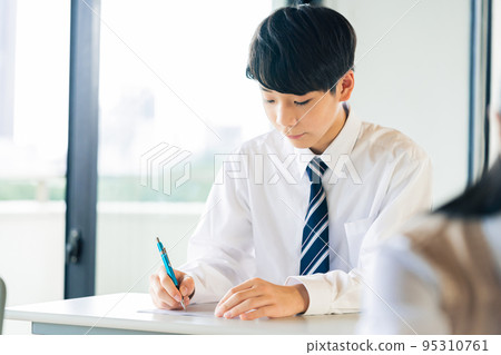 Male junior high school student studying Male junior high school student studying 95310761