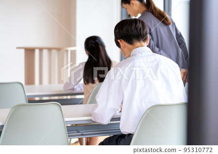 Junior high school students taking a test Junior high school students taking a test 95310772