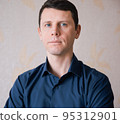 Handsome business man in blue shirt with blue eyes 95312901