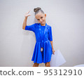 Beautiful happy smiling gymnast and dance girl in sportswear dress showing her medals. 95312910