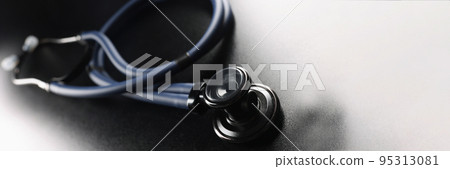 Black stethoscope on a dark matte background 95313081