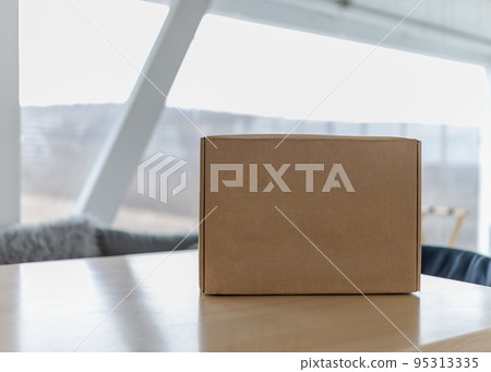 Copy-space box on table against background of cloudy autumn day Copy-space box on table against background of cloudy autumn day 95313335