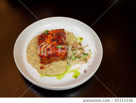 Healthy piece of cooked meat with porridge and salad Healthy piece of cooked meat with porridge and salad 95313336