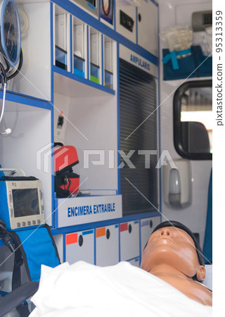ambulance perfectly equipped with emergency equipment and dummy for first aid practices 95313359