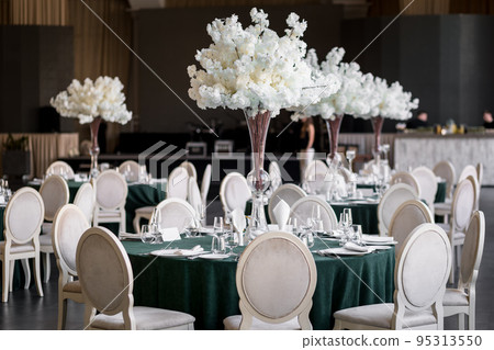banquet dinner tables with white chairs and white flower bouquet banquet dinner tables with white chairs and white flower bouquet 95313550