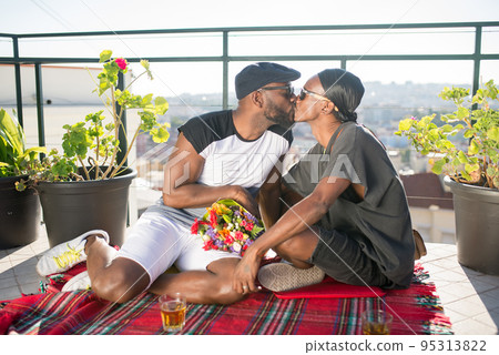 Portrait of Afro American gay couple kissing 95313822