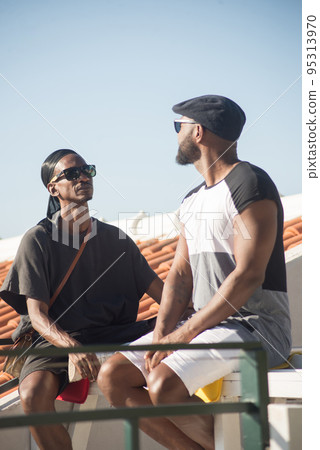 Portrait of two happy African gay men staring at each other Portrait of two happy African gay men staring at each other 95313970