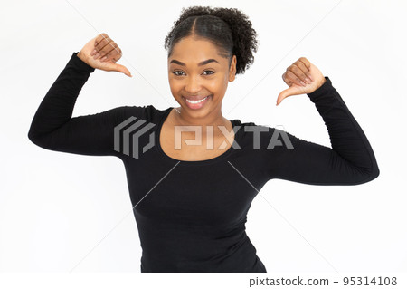 Portrait of successful young woman pointing at herself 95314108