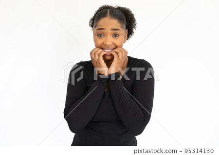 Portrait of anxious young woman biting nails Portrait of anxious young woman biting nails 95314130