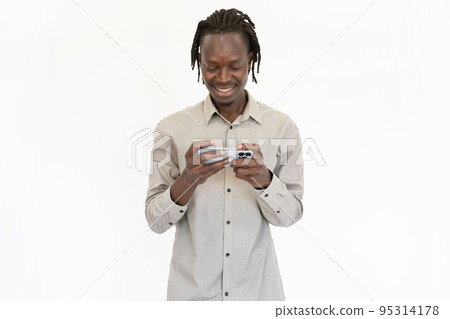 Portrait of positive young man watching video on mobile phone 95314178