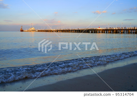 Sopot Pier at dusk with a wooden ship Sopot Pier at dusk with a wooden ship 95314704