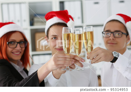 Group of people celebrating christmas or new year, corporate festive party in office 95314953