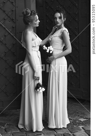 Two beautiful bridesmaids girls blonde and... - Stock Photo [95315095] -  PIXTA