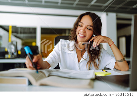 Young operator woman agent with headsets working in a call centre. Call center service. 95315515