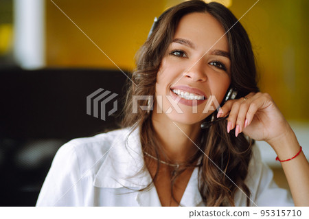 Young woman, student, teacher, business woman wear wireless headset video conference. Young woman, student, teacher, business woman wear wireless headset video conference. 95315710