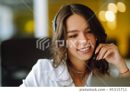 Young woman, student, teacher, business woman wear wireless headset video conference. Young woman, student, teacher, business woman wear wireless headset video conference. 95315711