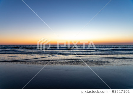 Sundown at the Dutch coastline between Noordwijk and Zandvoort. 95317101