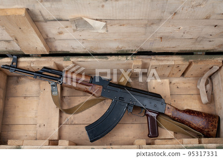 Kalashnikov AK47 gun in army green crate 95317331