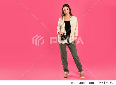 Professional photographer working on pink background in studio. Space for text Professional photographer working on pink background in studio. Space for text 95317930