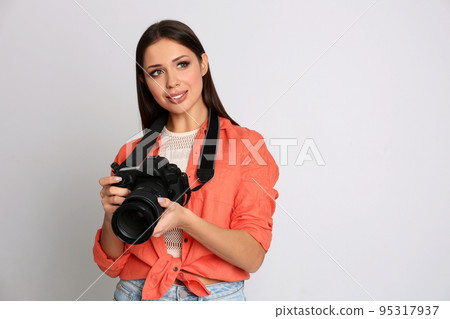 Professional photographer working on white background in studio Professional photographer working on white background in studio 95317937