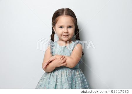 Cute little girl on light grey background 95317985