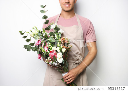 Florist with beautiful bouquet on light background, closeup 95318517