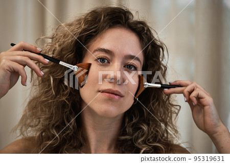 Face massage with brushes. Face massage with brushes. 95319631
