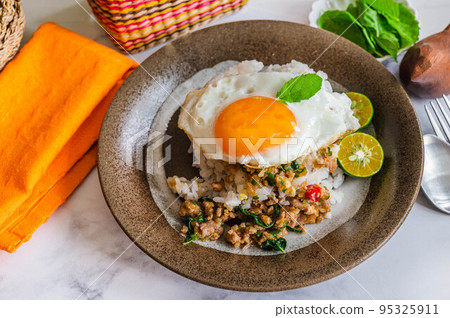 Gapao rice with fried egg Gapao rice with fried egg 95325911