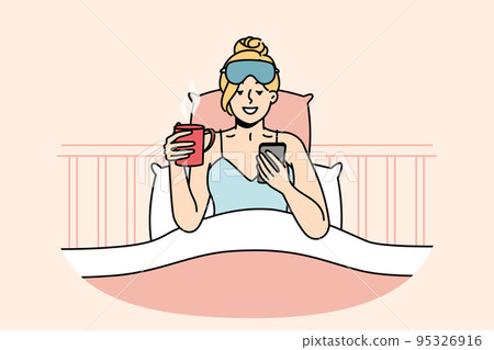 Awakened woman chats on cellphone, drinks coffee. 95326916