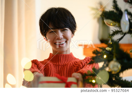 Girl giving Christmas present Close-up Girl giving Christmas present Close-up 95327084