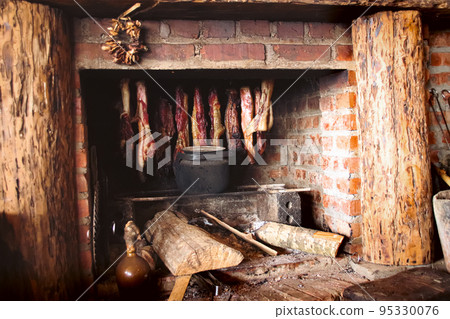 Smoked meat hanged on a stone fireplace, a common practice in the North of Vietnam 95330076