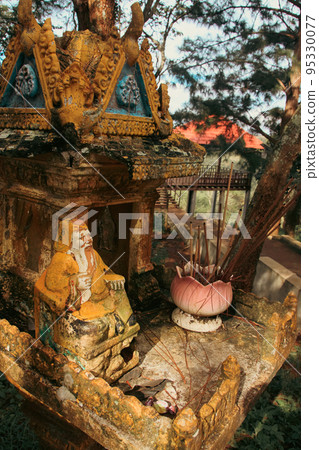 A wooden spirit house or tope taveda in khmer, believed to be a shrine to the protective spirit of a place 95330077