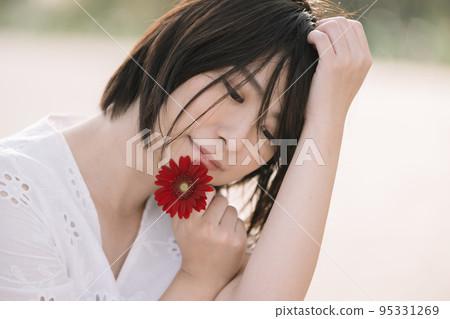 A woman in a white dress, a natural beauty image A woman in a white dress, a natural beauty image 95331269