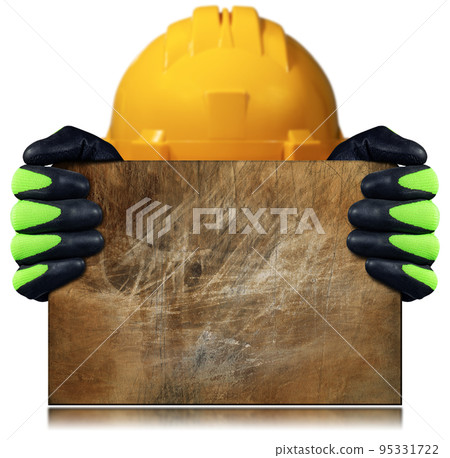 Manual Worker with Protective Work Gloves Holding a Rusty Metal Sheet 95331722