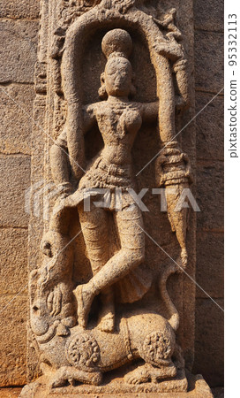 Closeup of dancing Statue at base of pillar, Roya Gopuram, Mahabalipuram, Tamilnadu, India 95332113
