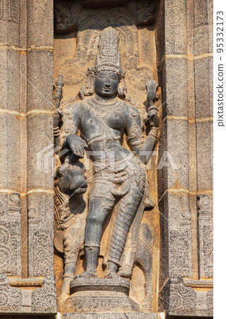 Carved idol of Lord Shiva as Ardhanarishwara half man and half woman on Gopuram of Nataraja Temple, Chidambaram, Tamil Nadu, India Carved idol of Lord Shiva as Ardhanarishwara half man and half woman on Gopuram of Nataraja Temple, Chidambaram, Tamil Nadu, India 95332173