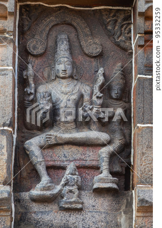 Carving Sculpture of Lord Shiva And Parvati on Gopuram of Nataraja Temple, Chidambaram Tamilnadu, India 95332259