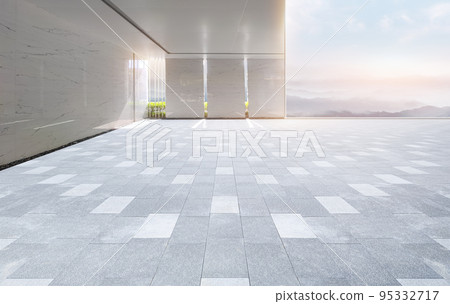 Empty brick plaza level buildings and panoramic ink wind mountains skyline 95332717