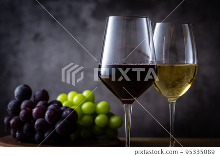 Two glasses of wine and grapes Two glasses of wine and grapes 95335089