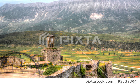 Panoramic view to Gjirokastra castle with the wall, tower and Clock, Gjirokaster, Albania Panoramic view to Gjirokastra castle with the wall, tower and Clock, Gjirokaster, Albania 95335304