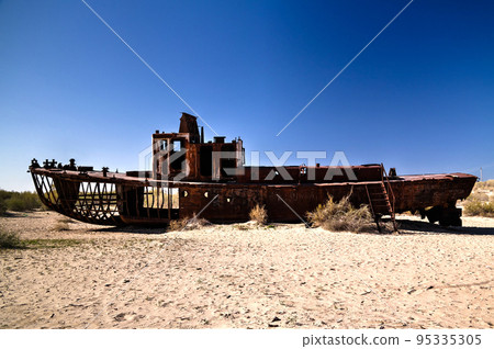 Panorama of ship cemetery near Moynaq at sunrise, Karakalpakstan, Uzbekistan 95335305