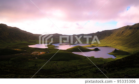 Landscape sunset view to Caldeirao crater, Corvo island, Azores, Portugal Landscape sunset view to Caldeirao crater, Corvo island, Azores, Portugal 95335306