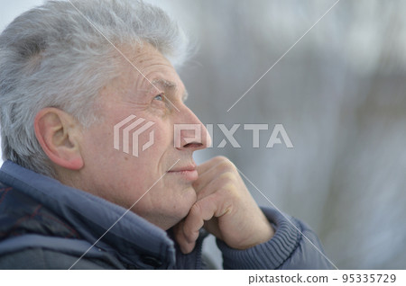 Portrait of a beautiful elderly pensive man 95335729