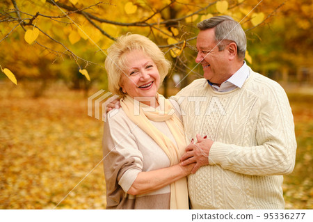 Active seniors on a walk in forest 95336277