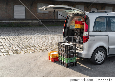 Delivery truck with Stollen Christmas pie packed in trunk near storage or shop 95336317