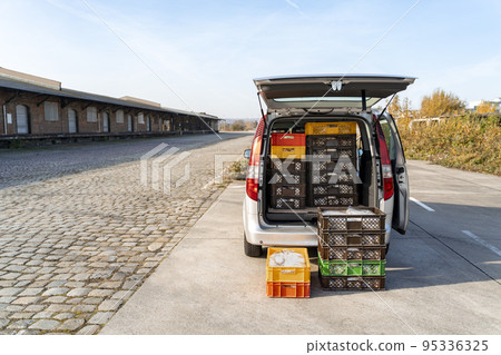 Delivery truck with Stollen Christmas pie packed in trunk near storage or shop 95336325