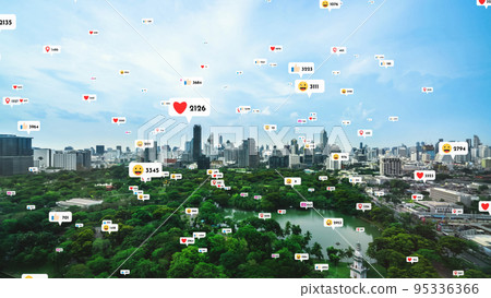 Social media icons fly over city downtown showing people reciprocity connection Social media icons fly over city downtown showing people reciprocity connection 95336366