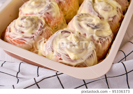 Homemade Pumpkin cinnamon rolls with cream cheese 95336373