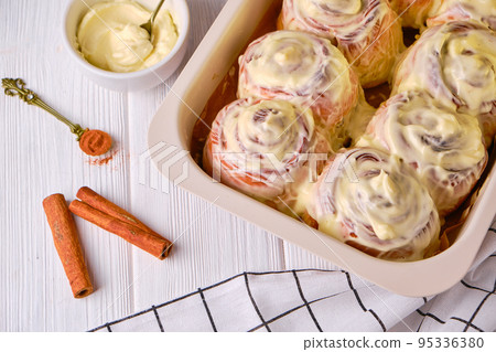 Homemade Pumpkin cinnamon rolls with cream cheese 95336380