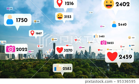 Social media icons fly over city downtown showing people reciprocity connection Social media icons fly over city downtown showing people reciprocity connection 95336595